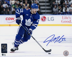 Jake McCabe Autographed Toronto Maple Leafs Puck Rush 8x10 Photo