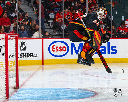 Pre-Order - Dustin Wolf Autographed Calgary Flames Alternate Jumping Horizontal 8x10 Photo