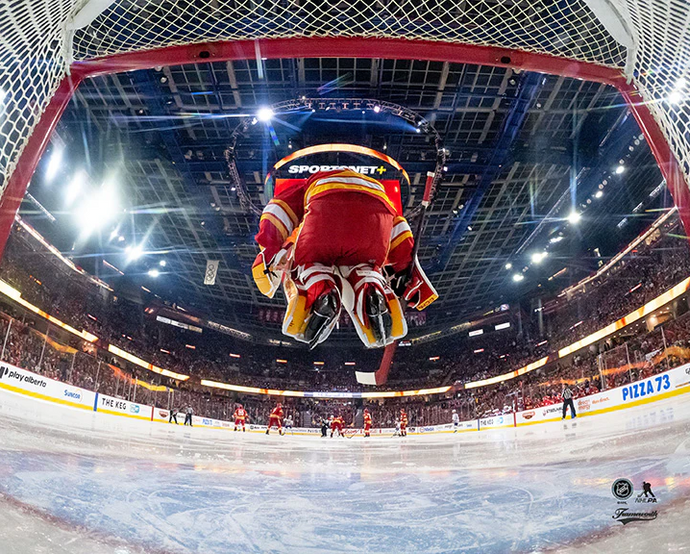 Pre-Order - Dustin Wolf Autographed Calgary Flames Jumping Home 8x10 Photo
