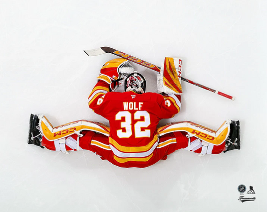 Pre-Order - Dustin Wolf Autographed Calgary Flames Home Stretching 8x10 Photo